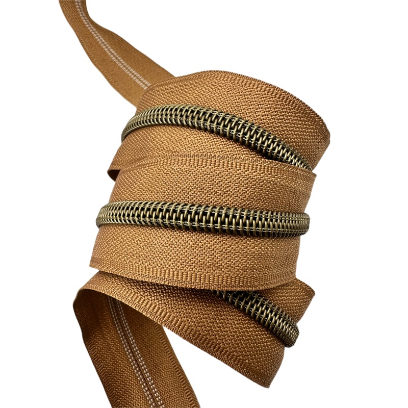 Camel zipper tape with antique teeth