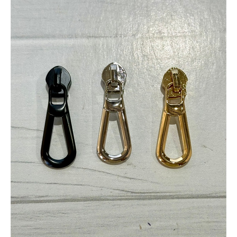 Elegant drip zipper pulls